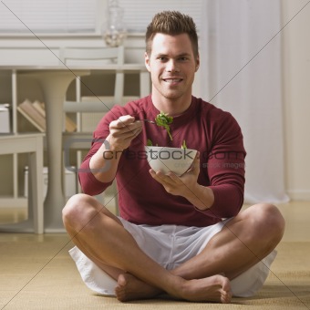Man with bowl of salad