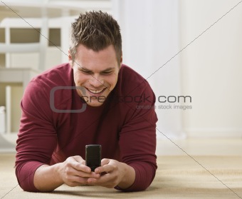 Attractive male with cell phone.