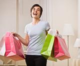 Smiling woman with shopping bags.