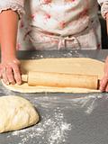 Chef rolling out dough
