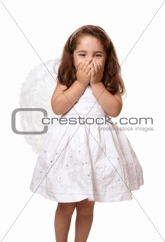 Little angel girl with hands covering her mouth