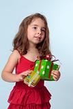 Little girl holding Christmas presents