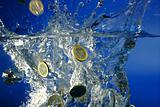 Euro coins fallin down to water