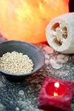 Aromatherapy, red candle, sea marine natural sponge and bowl of rice