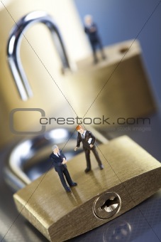 Business man on secure pedlock
