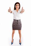 front view of smiling female executive with thumbs up