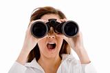 portrait of shocked woman looking through binocular