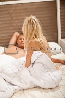 couple talking after sex in bedroom