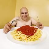 Eating a plate of spaghetti