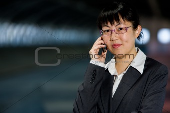 Asian business woman with mobile phone
