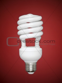 Fluorescent light bulb over red