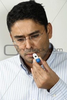 Checking his temperature