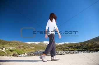 white woman walking in country