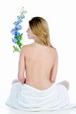 naked woman with white towel and a flower