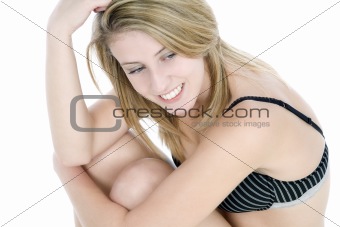 Young woman in underwear sitting