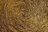 Yellow straw round bale, macro texture background