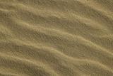 Wavy sea shore sand texture on sunshine
