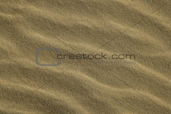 Wavy sea shore sand texture on sunshine