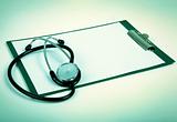 blank clipboard with stethoscope