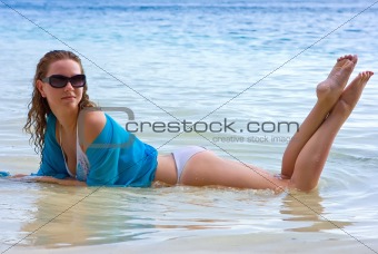 Brunette girl relaxing on the beach