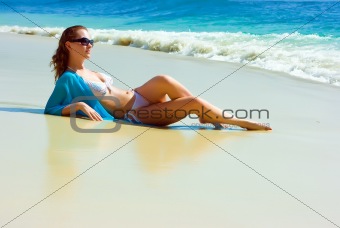 Brunette girl relaxing on the beach
