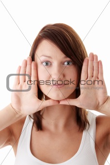 Woman framing her face with her hands