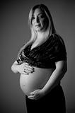 side pose of pregnant woman looking at camera