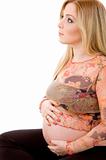 side pose of pregnant woman looking up