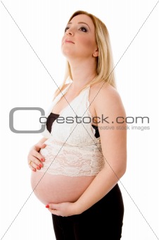 side pose of pregnant female holding her stomach