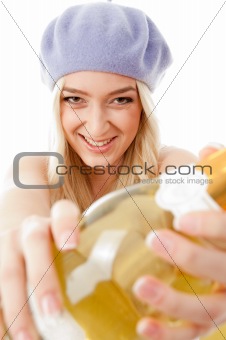 portrait of happy model showing champagne bottle