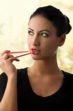 charming woman with chopstick