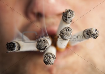 Man smoking six cigarettes