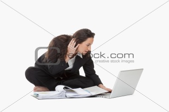 attractive young businesswoman working with laptop computer and files