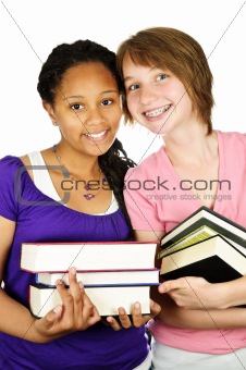 Girls holding text books