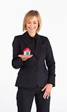 Frinedly mature businesswoman holding a house