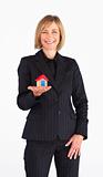 Businesswoman presenting a model of house