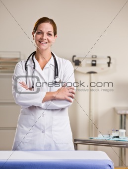 Doctor in lab coat in doctorÕs office