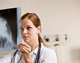 Doctor reviewing x-rays in doctorÕs office