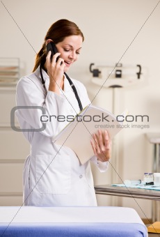 Doctor talking on telephone
