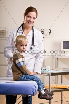 Doctor giving boy checkup in doctorÕs office