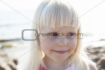 Smiling little girl outdoors.