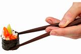 Roll with salmon in chopsticks (path isolated)