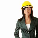 Young female architect or builder wearing a yellow hart hat