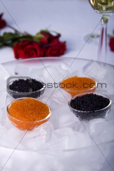 Red and black caviar on ice