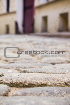 Paving stones. Small street in old town.