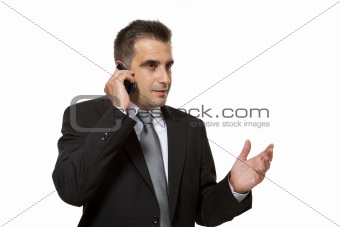 Young businessman speaks in mobile phone