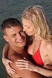 Couple at the beach embracing