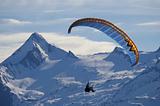 winter paragliding in alps mountain