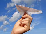  child hand with paper plane