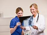 Doctor and woman looking at x-ray